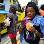 A teen eating italian ice