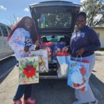 Frounder and teen with christmas gift bags