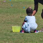 A small child looking for easter eggs